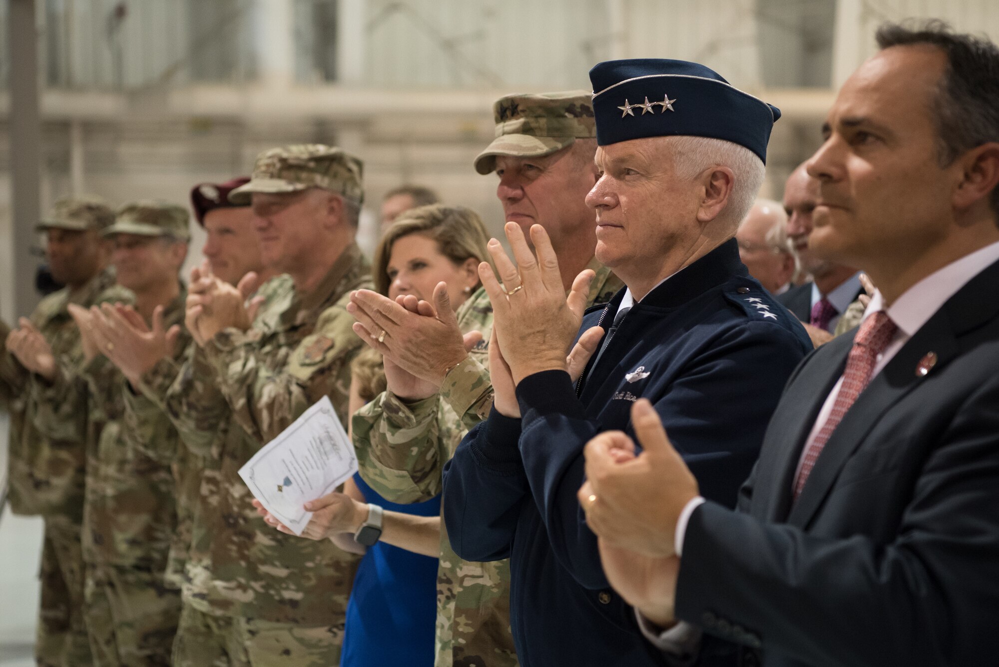 Kentucky Gov. Matt Bevin (far right), Lt. Gen. L. Scott Rice (second from right), director of the Air National Guard, and Army Maj. Gen. Stephen R. Hogan (third from right), adjutant general of the Kentucky National Guard, applaud Tech. Sgt. Daniel Keller, a combat controller in the 123rd Special Tactics Squadron, during a ceremony at the Kentucky Air National Guard Base in Louisville, Ky, Aug.13, 2019. At the ceremony, Air Force Chief of Staff Gen. David L. Goldfein presented Keller with the Air Force Cross, which Keller earned for valor on the battlefield in Afghanistan. (U.S. Air National Guard photo by Staff Sgt. Joshua Horton)