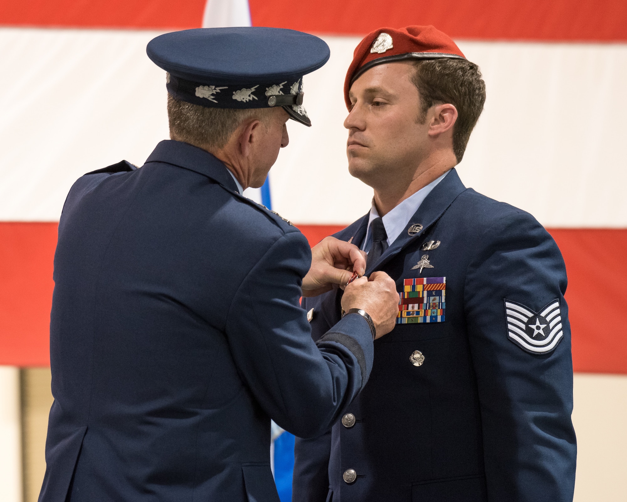Air Force Chief of Staff Gen. David L. Goldfein (left) pins the Air Force Cross to the uniform of Tech. Sgt. Daniel Keller, a combat controller in the 123rd Special Tactics Squadron, during a ceremony at the Kentucky Air National Guard Base in Louisville, Ky, Aug.13, 2019. Keller earned the award — second only to the Medal of Honor — for valor on the battlefield in Afghanistan. (U.S. Air National Guard photo by Dale Greer)