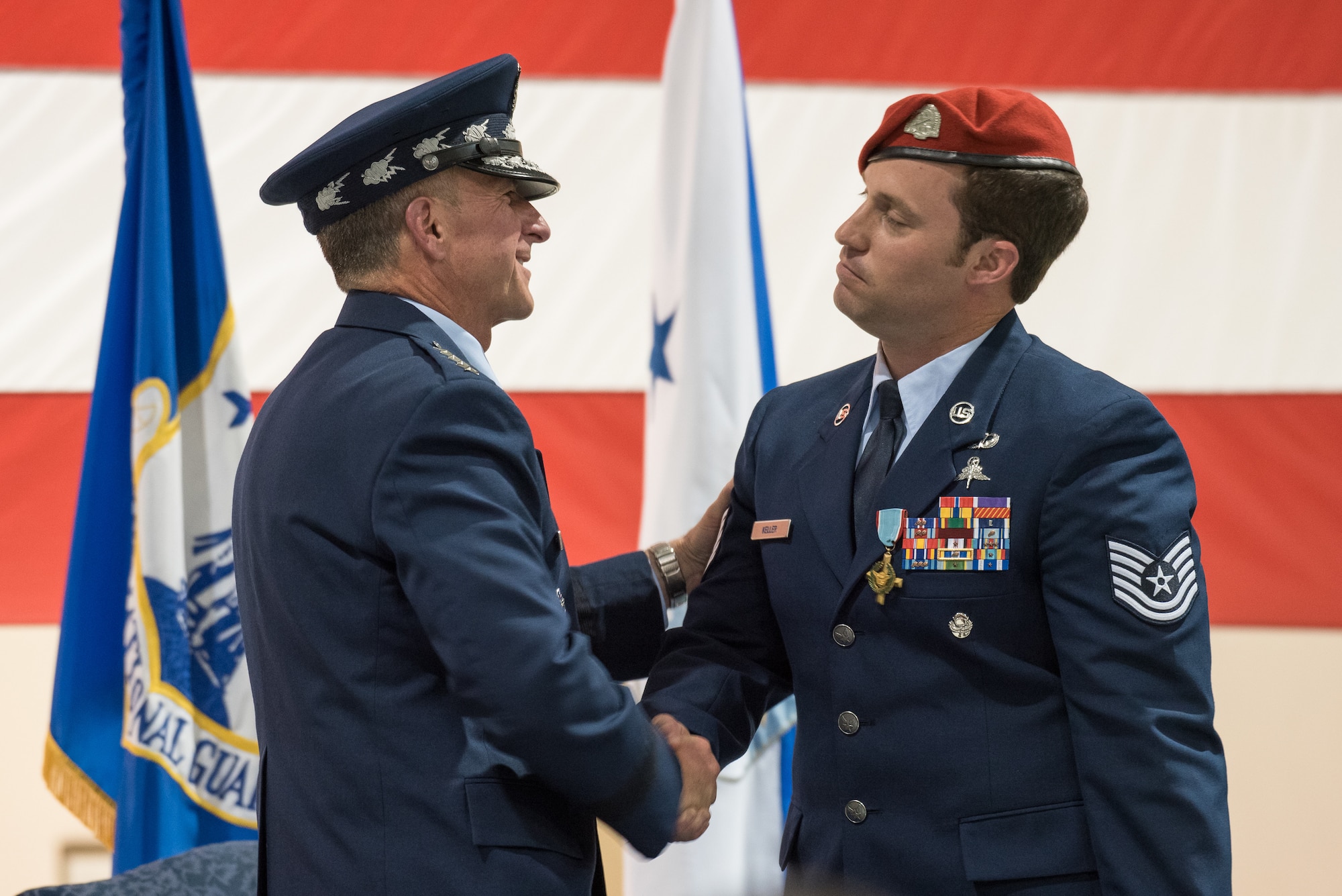 Air Force Chief of Staff Gen. David L. Goldfein (left) shakes hands with Tech. Sgt. Daniel Keller, a combat controller in the 123rd Special Tactics Squadron, during a ceremony at the Kentucky Air National Guard Base in Louisville, Ky, Aug.13, 2019. Earlier in the ceremony, Goldfein presented Keller with the Air Force Cross, which Keller earned for valor on the battlefield in Afghanistan. (U.S. Air National Guard photo by Dale Greer)