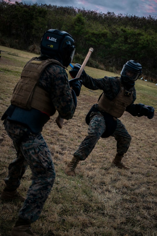 Students with the Marine Martial Arts Instructors Course (MAIC) engage in a close combat, Marine Corps Base Hawaii, Sept. 12, 2019. MAIC is a knowledge driven course that educates students on proper techniques and assisting others in elevating their belt level while also teaching them the methods needed to instruct their own courses. (U.S. Marine Corps photo by Cpl. Matthew Kirk)