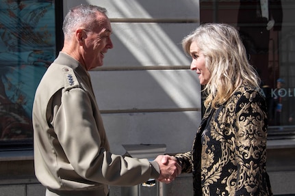 Man and woman shaking hands.