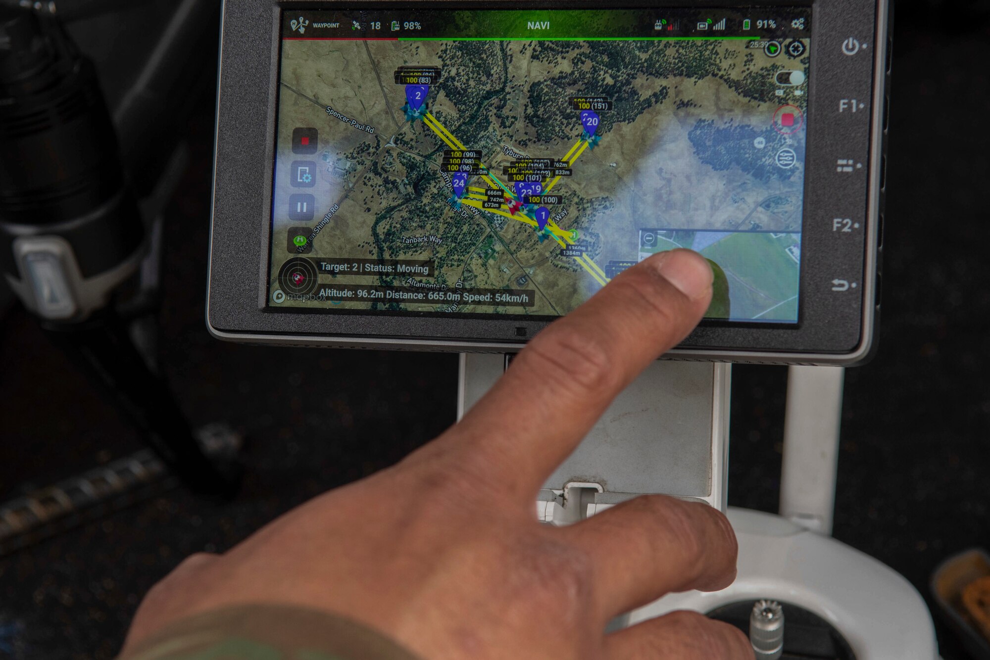 U.S. Air Force Staff Sgt. Staff Sgt. Francis Arnaldo, 9th Security Forces Squadron resource protection NCO in charge, points to Hivemapper drone imagery taken at the perimeter of Beale Air Force Base, California, April 12, 2019. Beale is currently the first base to beta-test the Hivemapper program, a drone capability that records and senses change detection. (U.S. Air Force photo by Tech. Sgt. Veronica Montes)