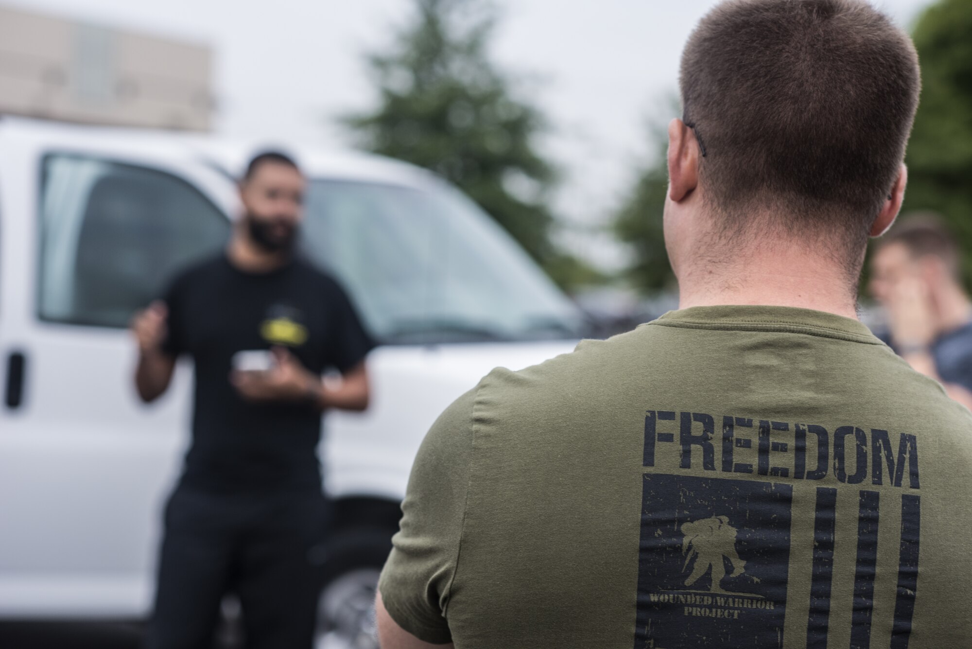 Tech. Sgt. Joshua Schmitz, 818th Mobility Support Advisory Squadron survival, evasion, resistance and escape specialist, listens to instructions before a 100 mile ruck march on Joint Base McGuire-Dix-Lakehurst, New Jersey Sept. 10, 2019. The march commemorates the fallen individuals during the attacks on Sept. 11. Every year volunteers walk from Joint Base MDL to the 9/11 Memorial, New York City to raise money along the way while informing passersby of the cause. (U.S. Air Force photo by Airman 1st Class Ariel Owings)