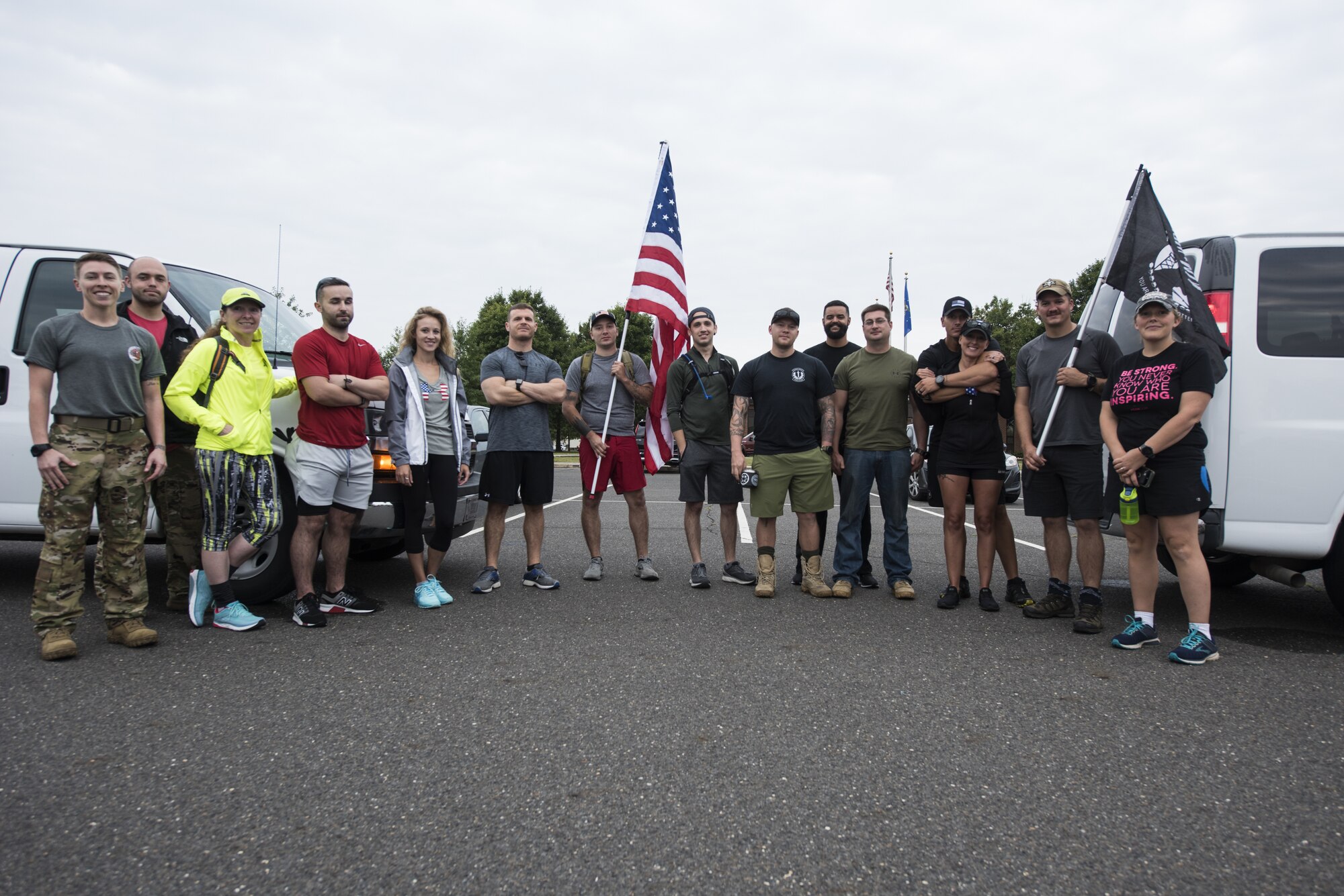 Participants prepare for the 100 mile ruck march on Joint Base McGuire-Dix-Lakehurst, New Jersey Sept. 10, 2019. Every year volunteers walk from Joint Base MDL to the 9/11 Memorial, New York City to raise money along the way while informing passersby of the cause. Throughout the 100 miles, participants took turns carrying a prisoner of war/missing in action flag along with an American flag that served in Afghanistan to commemorate the individuals who lost their lives during the attacks. (U.S. Air Force photo by Airman 1st Class Ariel Owings)
