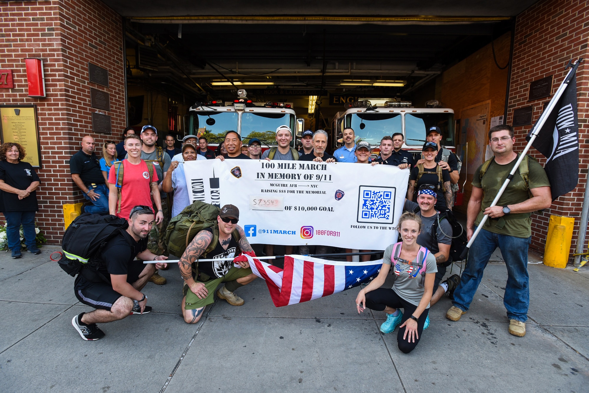 Participants stop by Engine 24, Ladder 5 Fire Department during the 100 mile ruck march in honor of Sept. 11 in New York City Sept. 11, 2019. Volunteers of the annual ruck march stopped at fire departments along the way to thank firefighters for their service, shared memories of that day 18 years ago, and exchanged unit patches. The march raised more than $10,000 that went towards the maintenance of the 9/11 Memorial and Museum. (U.S. Air Force photo by Airman 1st Class Ariel Owings)