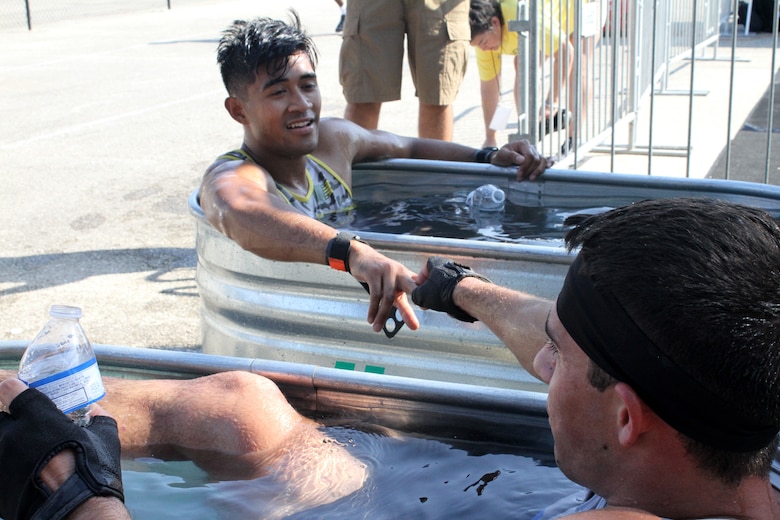 From left, U.S. Army 2nd Lt. Chris Gabayan and U.S. Air Force 2nd Lt. Rhett Spongberg talk about how they pushed each other to be the best they could be while tackling the course during the 2019 Alpha Warrior Inter-Service Battle Sept. 14, 2019, at Retama Park, Selma, Texas. Although Gabayan inched out Spongberg during their heat, the Air Force won the battle with the Army coming in second followed by the Navy. (U.S. Air Force photo by Debbie Aragon)