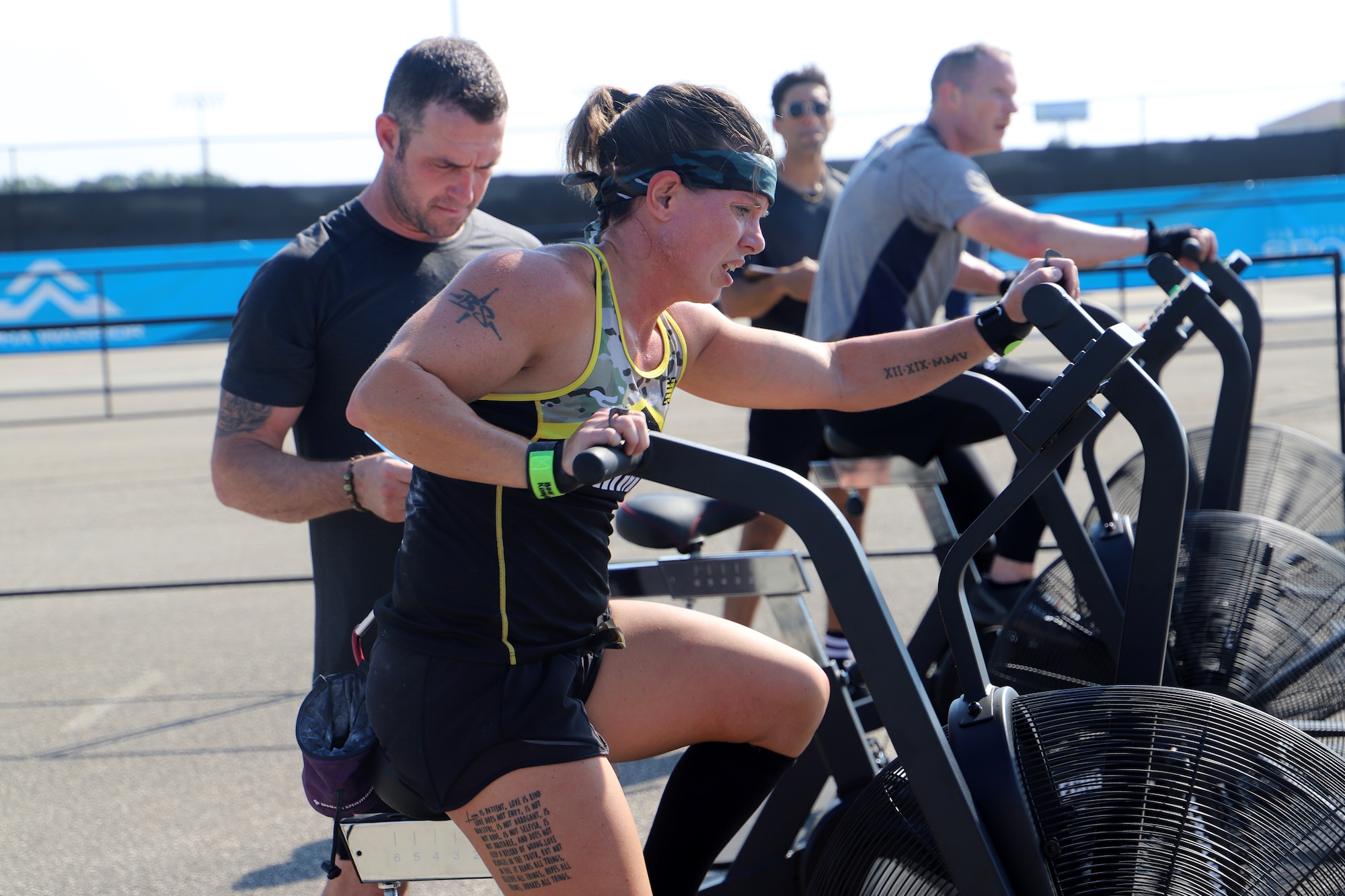 U.S. Army Sgt. Bawnie Sutton pedals an air bike during her heat of the 2019 Alpha Warrior Inter-Service Battle Sept. 14, 2019, at Retama Park, Selma, Texas. Sutton and her five team mates finished the competition in second place, behind the U.S. Air Force. The U.S. Navy finished third. (U.S. Air Force photo by Victoria Ribiero)
