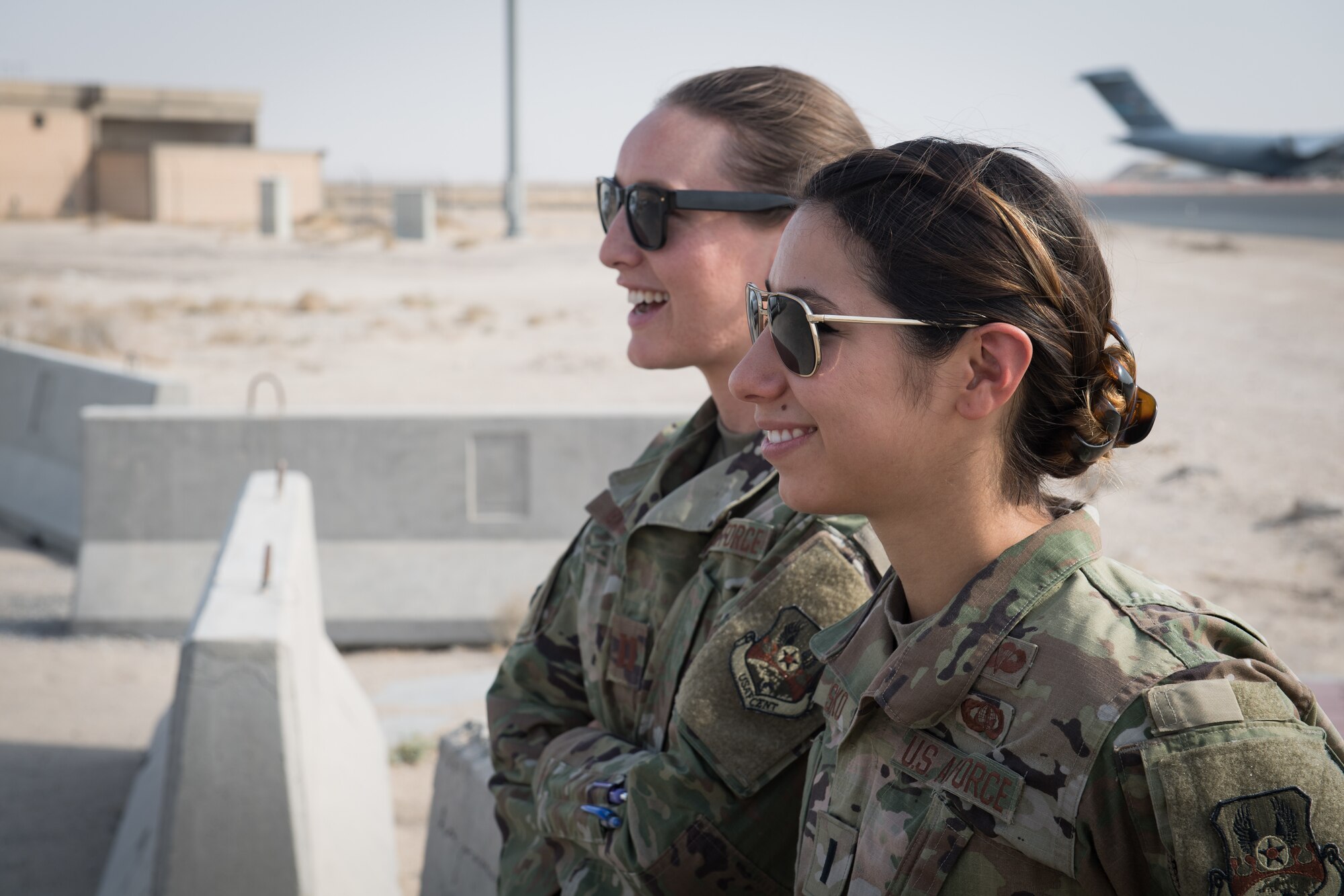 Capt. Rosa-Mae Bacon, 386th Air Expeditionary Wing, chief of protocol; and 1st Lt. Kassandra Prusko, 386th AEW deputy chief of protocol, have a friendly chat outside the protocol next to the flight line at Ali Al Salem Air Base, Kuwait, Aug. 15, 2019. Bacon is deployed from Davis-Monthan Air Force Base, Arizona; and Prusko is deployed from Andrews AFB, Maryland. (U.S. Air Force photo by Tech. Sgt. Daniel Martinez)