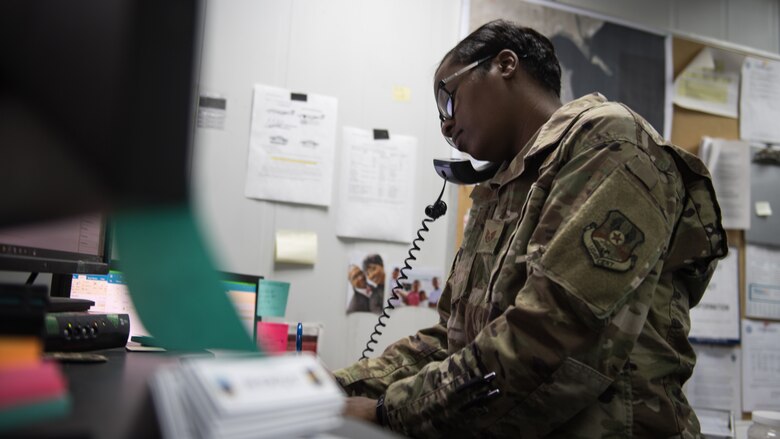 Staff Sgt. Courtney Lansden, 386th Air Expeditionary Wing protocol speciailist, speaks with a visiting distinguished visitors own protocol officer to facilitate a possible visit at Ali Al Salem Air Base, Kuwait, Aug. 15, 2019. Landsden is deployed from Offutt Air Force Base, Nebraska. (U.S. Air Force photo by Tech. Sgt. Daniel Martinez)