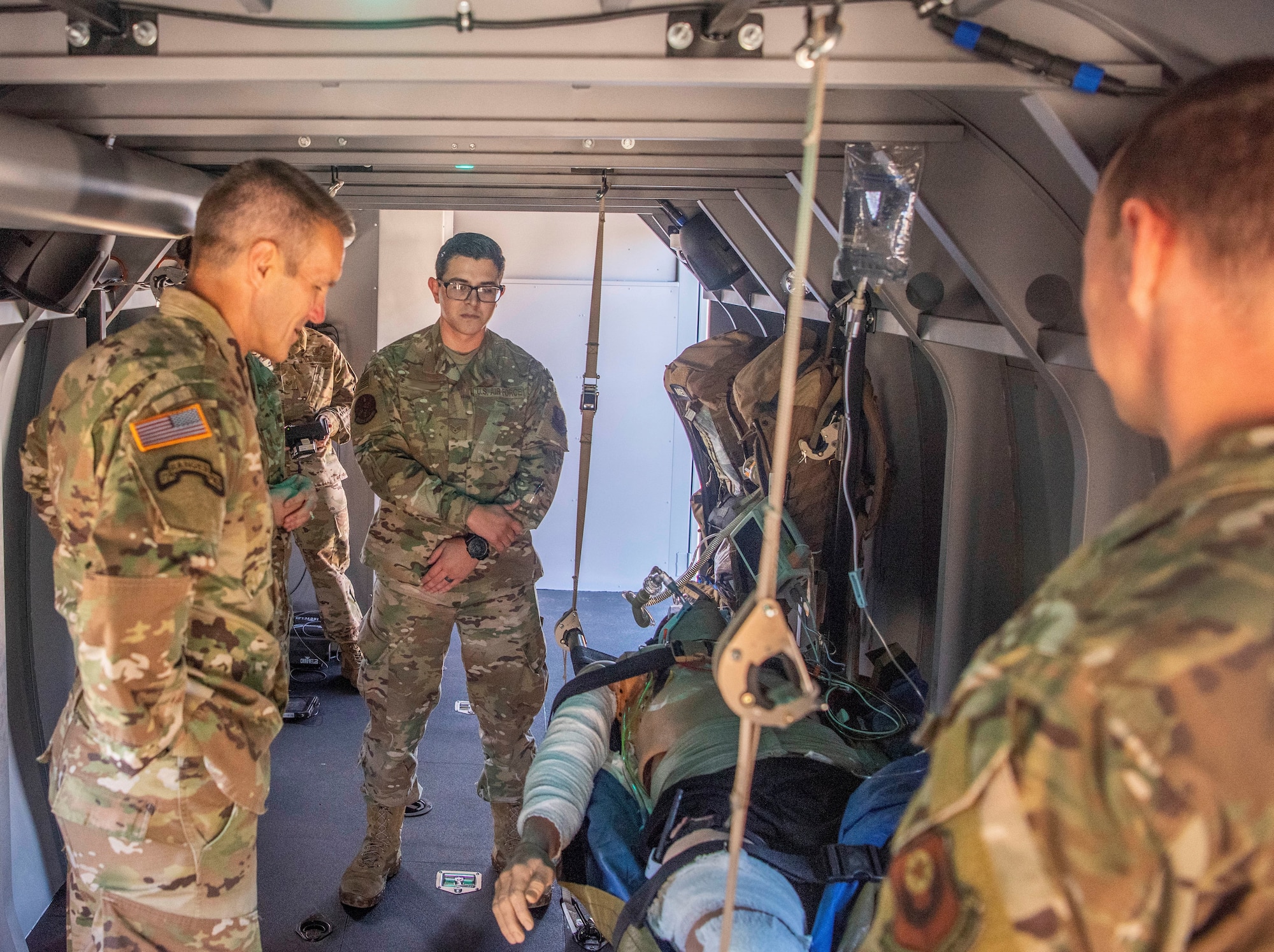 U.S. Army Gen. Richard D. Clarke, United States Special Operations Command commander, learns about a medical simulator 352nd Special Operations Wing Airmen train on at RAF Mildenhall, England, Sept. 12, 2019, during a site visit. 352nd SOW is the only AFSOC medical flight to have its own CV-22 Medical Simulator. (U.S. Air Force photo by Airman 1st Class Joseph Barron)