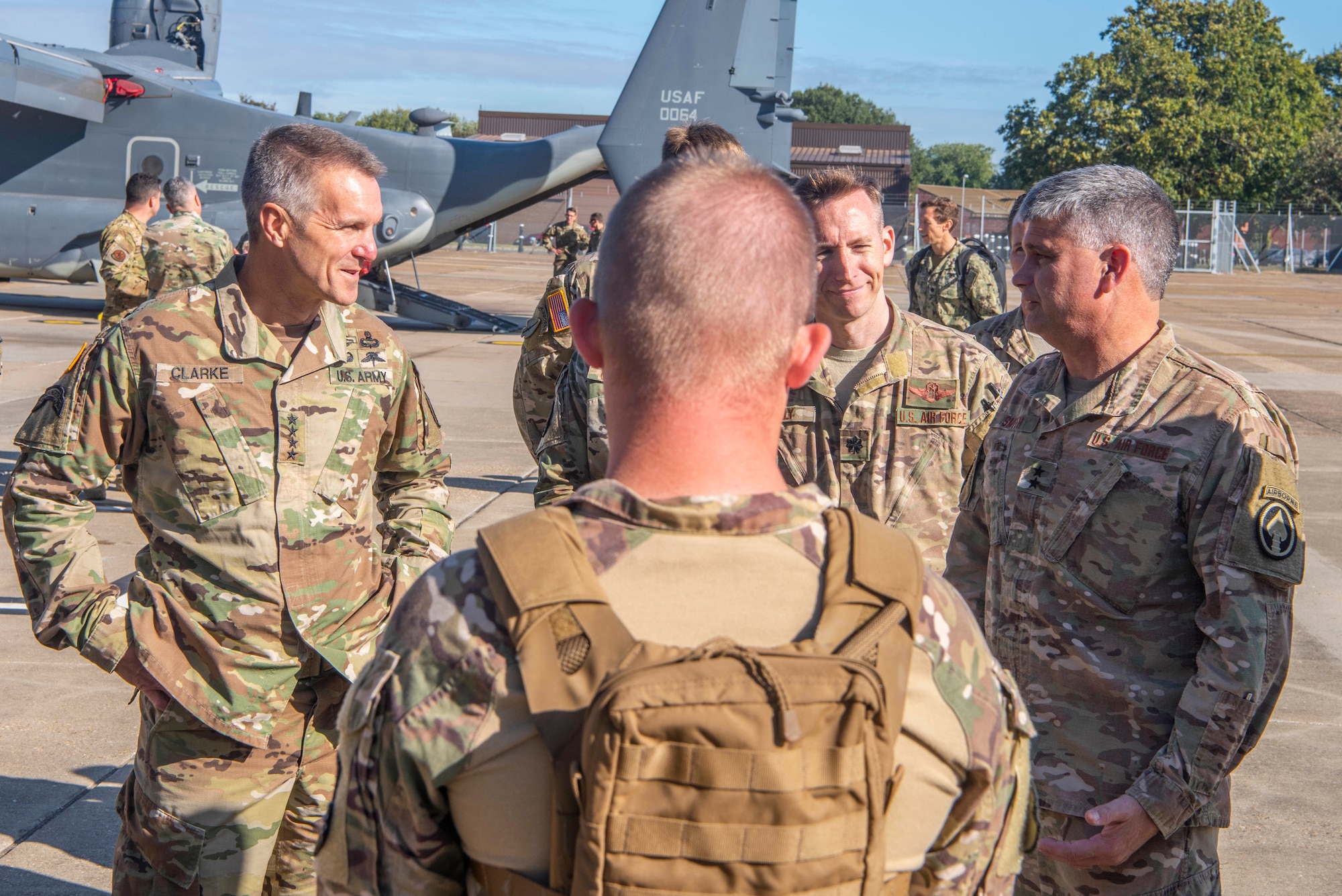 U.S. Army Gen. Richard D. Clarke, United States Special Operations Command commander, speaks with U.S. Air Force Maj. Gen. Kirk W. Smith, Special Operations Command Europe commander, on a tour of the 352nd Special Operations Wing at RAF Mildenhall, England, Sept. 12, 2019. The mission of the 352nd SOW, part of Air Force Special Operations Command, is to provide combat ready, responsive, specialized airpower and combat support to execute the full spectrum of SOF missions. (U.S. Air Force photo by Airman 1st Class Joseph Barron)