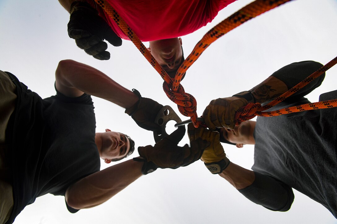 Pacific Air Forces firefighters secure life-safety rope prior to a rescue scenario during a Department of Defense Rescue Technician course, Sept. 9, 2019, at Osan Air Base, Republic of Korea. Instructors from Andersen Air Force Base, Guam’s 554th RED HORSE Squadron trained and tested 10 Pacific Air Forces firefighters from three bases on high-risk, elevated and confined space rescue tactics. (U.S. Air Force photo by Staff Sgt. Greg Nash)