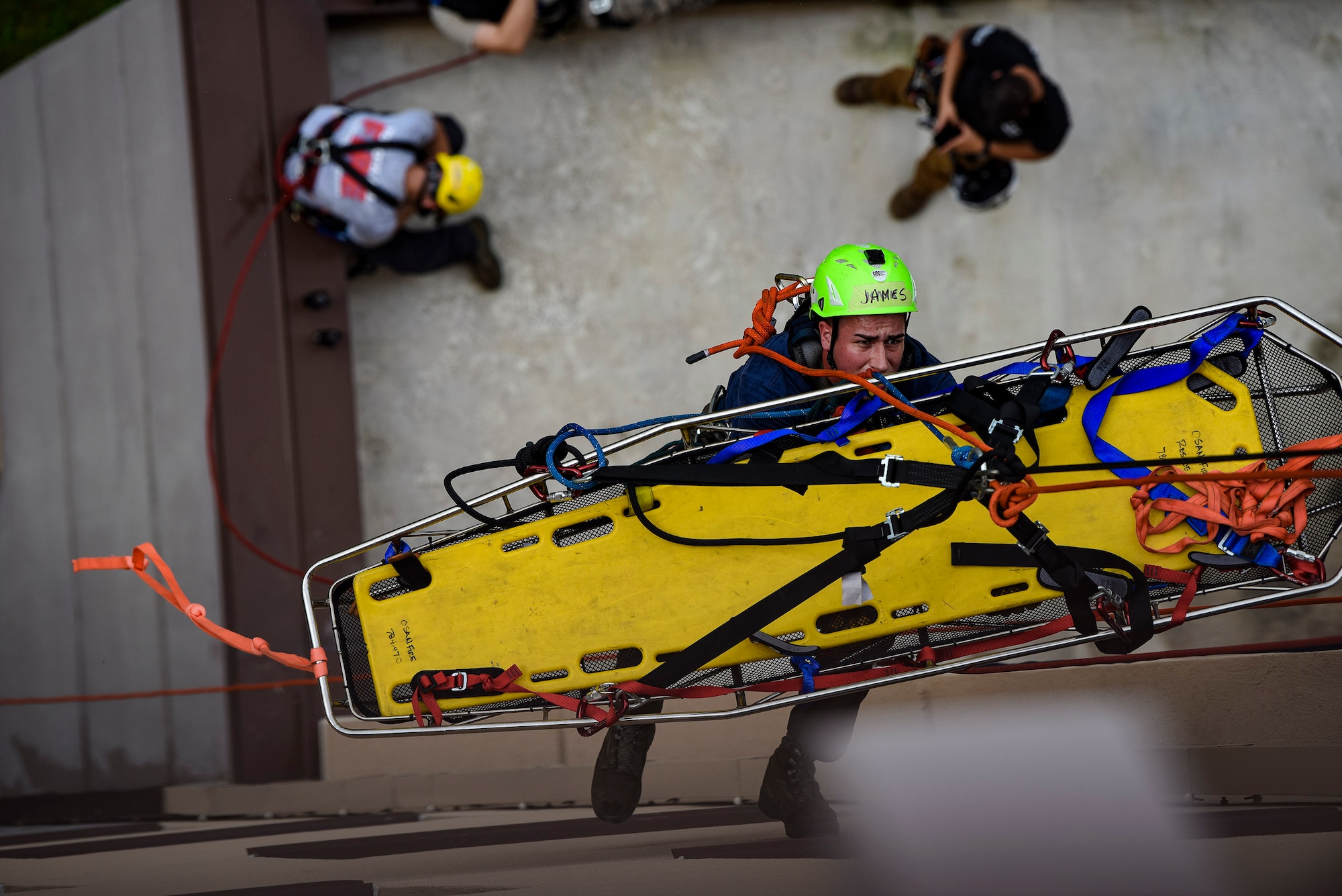 Senior Airman James Selph, 51st Civil Engineer Squadron firefighter, descends an eight-story building to perform a rescue scenario during a Department of Defense Rescue Technician course, Sept. 9, 2019, at Osan Air Base, Republic of Korea. Instructors from Andersen Air Force Base, Guam’s 554th RED HORSE Squadron trained and tested 10 Pacific Air Forces firefighters from three bases on high-risk, elevated and confined space rescue tactics. (U.S. Air Force photo by Staff Sgt. Greg Nash)