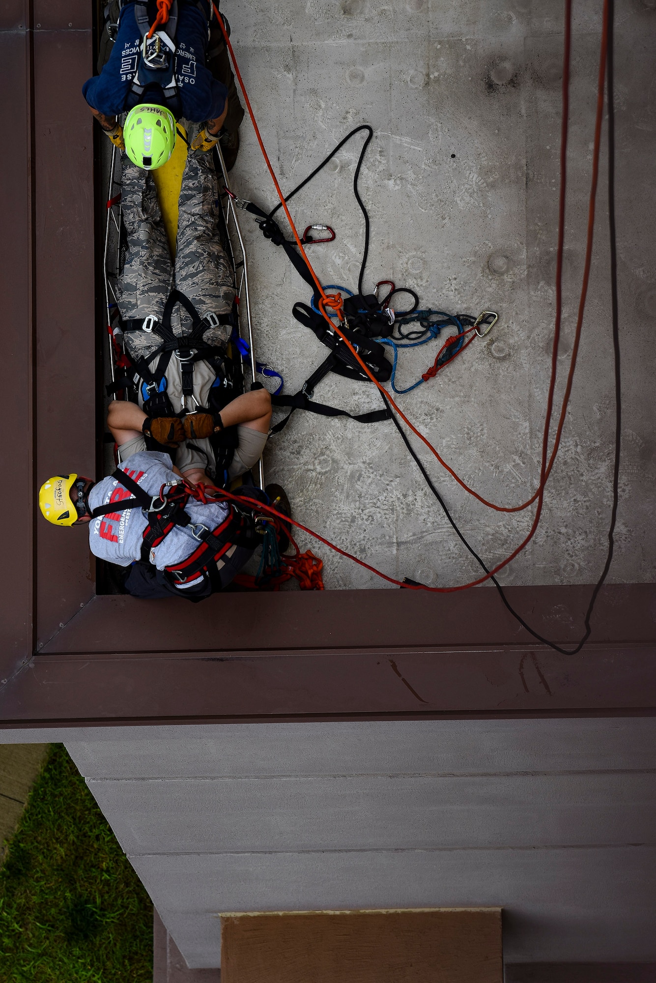 Pacific Air Forces firefighters secure a simulated victim into a stokes basket during a Department of Defense Rescue Technician course, Sept. 9, 2019, at Osan Air Base, Republic of Korea. Instructors from Andersen Air Force Base, Guam’s 554th RED HORSE Squadron trained and tested 10 Pacific Air Forces firefighters from three bases on high-risk, elevated and confined space rescue tactics. (U.S. Air Force photo by Staff Sgt. Greg Nash)