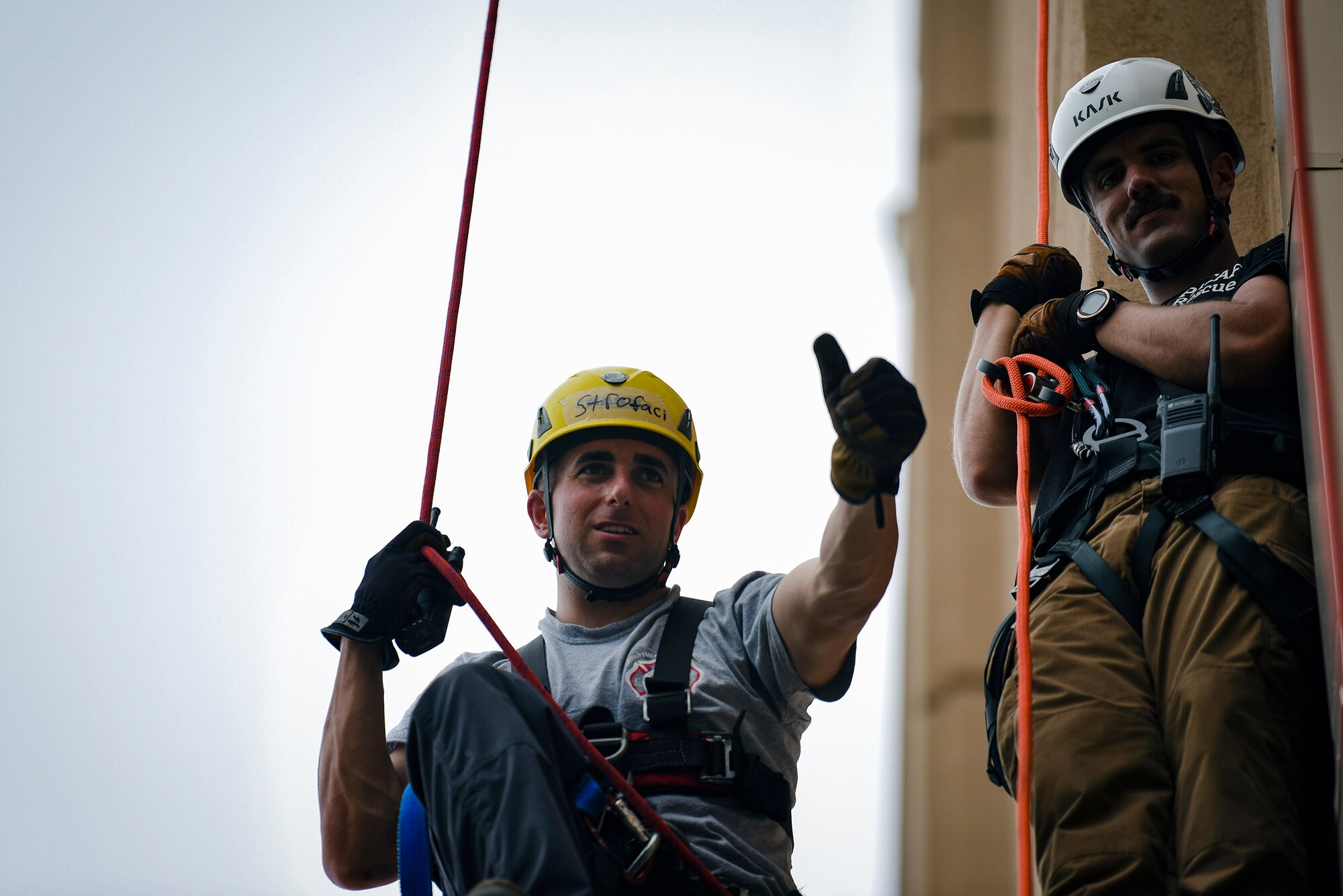 Staff Sgt. William Campbell, Department of Defense United States Pacific Command Rescue Technician course lead instructor, watches as Airman 1st Class Jade Strofaci, 374th Civil Engineer Squadron firefighter, Yokota Air Base, Japan, gives a thumbs-up to his teammate as part of a rescue scenario during a DoD Rescue Technician course, Sept. 9, 2019, at Osan Air Base, Republic of Korea. Instructors from Andersen Air Force Base, Guam’s 554th RED HORSE Squadron trained and tested 10 Pacific Air Forces firefighters from three bases on high-risk, elevated and confined space rescue tactics. (U.S. Air Force photo by Staff Sgt. Greg Nash)