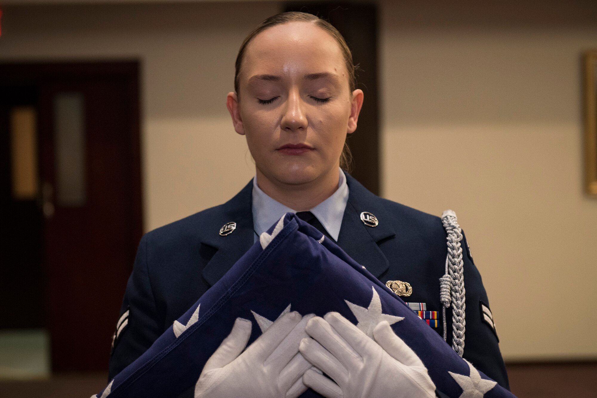 U.S. Air Force Airman 1st Class Molly Collyer, 39th Air Base Wing honor guardsmen holds a folded flag during a 9/11 remembrance ceremony Sept. 11, 2019, at Incirlik Air Base, Turkey. The flag folding honored the brave men and women who lost their lives as a consequence of the 9/11 terrorist attacks and resulting conflicts. (U.S. Air Force photo by Staff Sgt. Ceaira Tinsley)