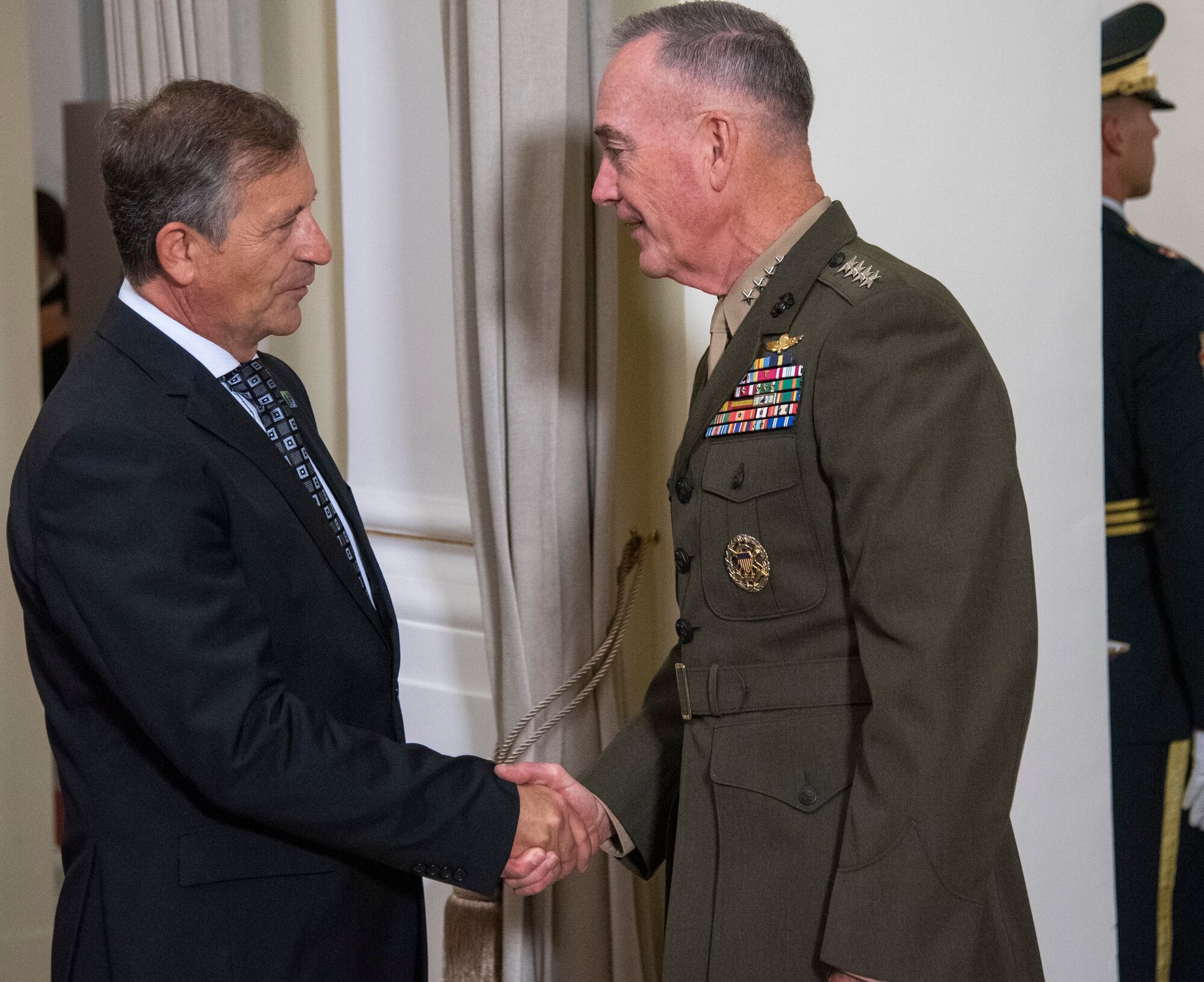 Marine Corps Gen. Joe Dunford, chairman of the Joint Chiefs of Staff, meets Karl Erjavec, the Slovenian minister of defense, during the opening ceremony of the North Atlantic Treaty Organization Military Committee Conference at the National Gallery in Ljubljana, Slovenia,  Sept. 13, 2019.
