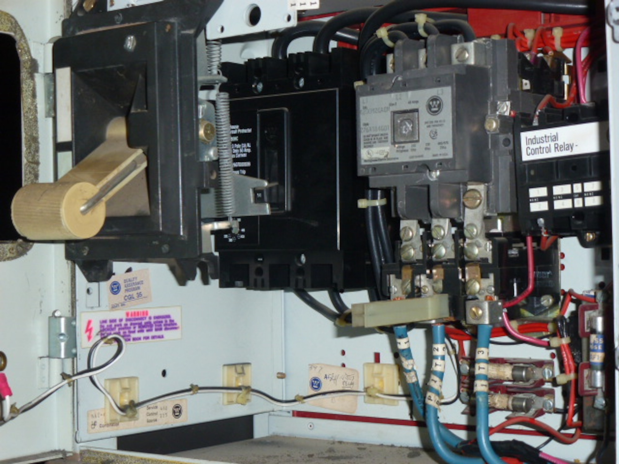 Paul Kurtz, an intern with the Test Operations and Sustainment contractor National Aerospace Solutions, worked to develop a 3D-printed version of a breaker handle, pictured at left, which had been in use since the 1970s as part of the C-Plant Lube Oil System. The handle is no longer manufactured. (U.S. Air Force photo)