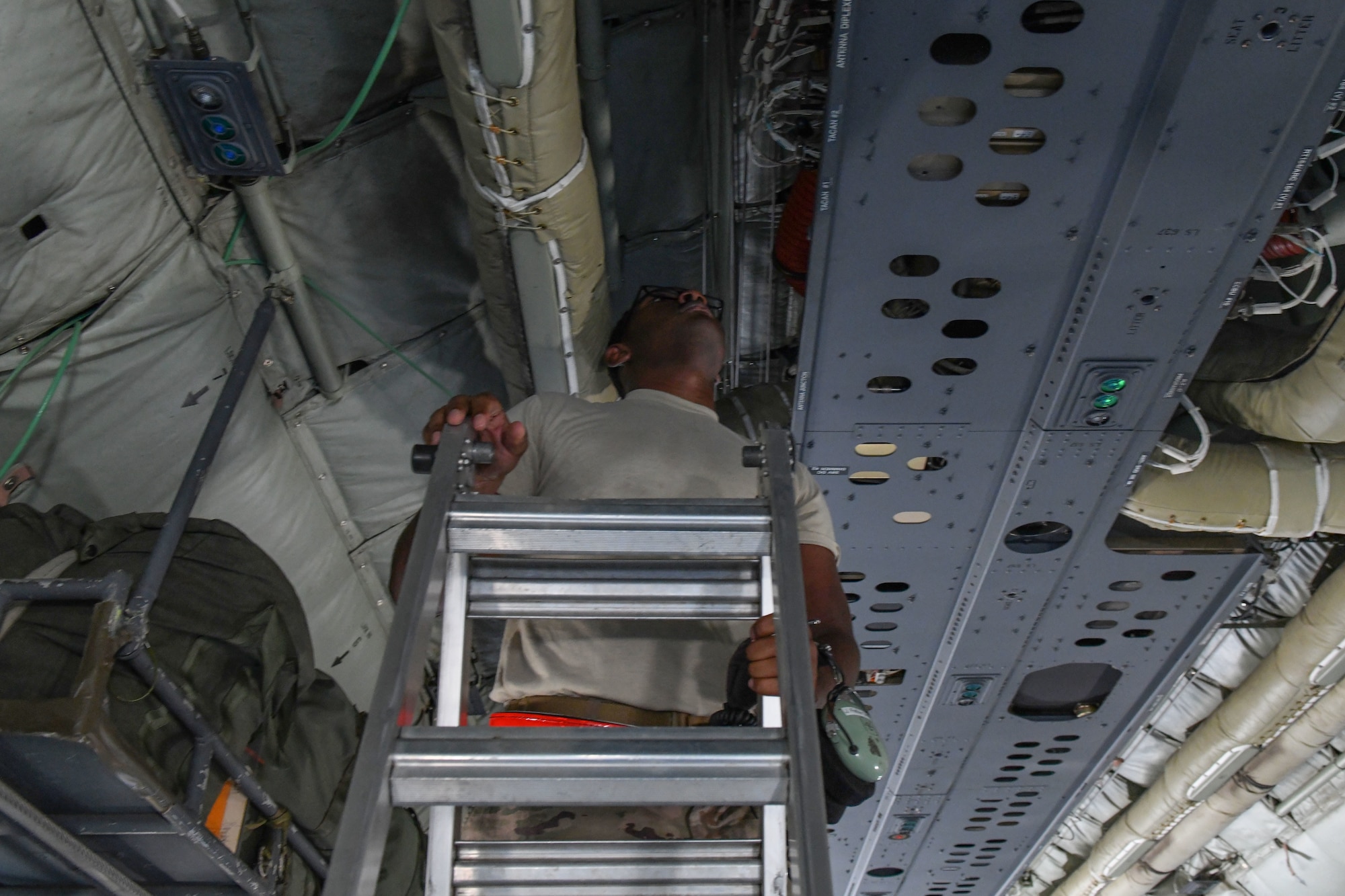 a man fixes a plane