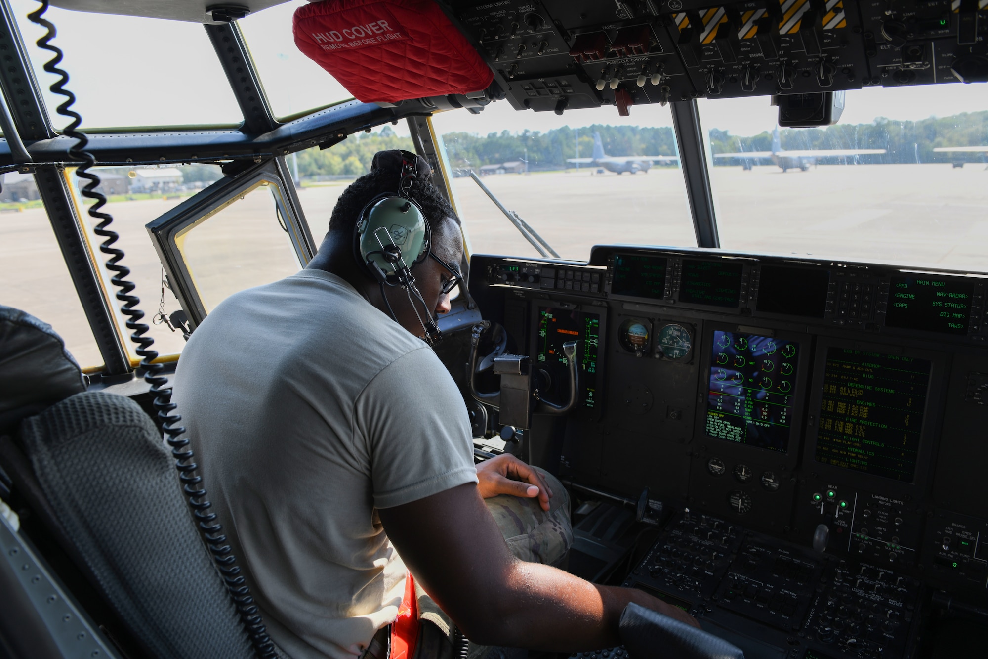 a man fixes a plane