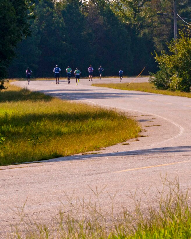 Seven Airmen assigned to the 96th Aerial Port Squadron participate in an official physical fitness test Sunday, Sept. 8, 2019, at Little Rock Air Force Base, Ark. Over the drill weekend, the unit fitness program manager and physical training leaders evaluated more than 100 Airmen to ensure annual readiness requirements were upheld. The Air Force Reserve’s overall readiness depends on the individual readiness of each Reserve Citizen Airman. (U.S. Air Force Reserve photo by Maj. Ashley Walker)