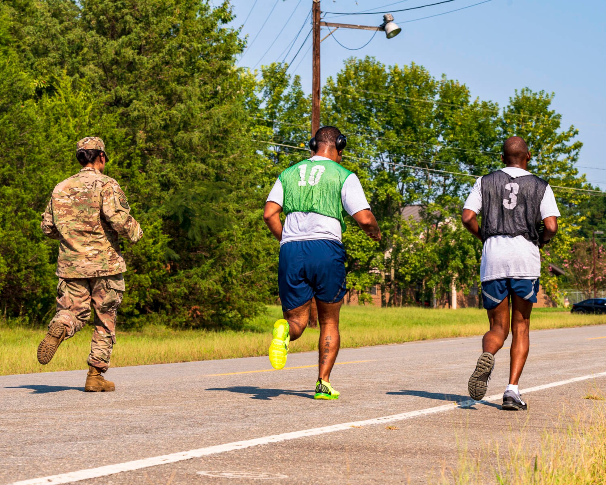 An Airman assigned to the 96th Aerial Port Squadron and a supportive wingmen finishes the run portion of an official physical fitness test Sunday, Sept. 8, 2019, at Little Rock Air Force Base, Ark. Over the drill weekend, the unit fitness program manager and physical training leaders evaluated more than 100 Airmen to ensure annual readiness requirements were upheld. The Air Force Reserve’s overall readiness depends on the individual readiness of each Reserve Citizen Airman. (U.S. Air Force Reserve photo by Maj. Ashley Walker)
