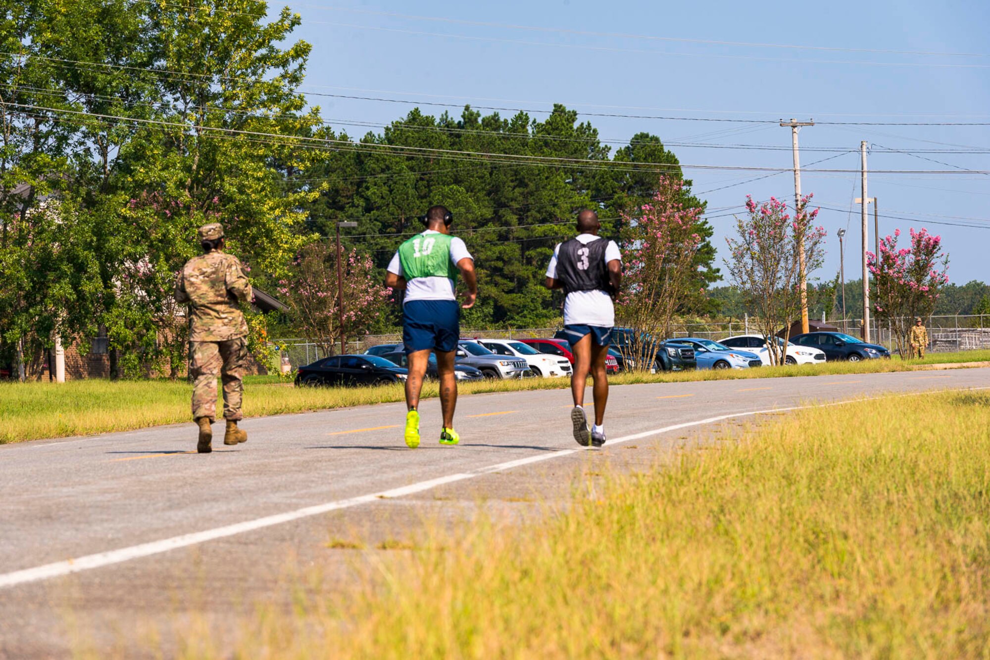 An Airman assigned to the 96th Aerial Port Squadron and supportive wingmen finishes the run portion of an official physical fitness test Sunday, Sept. 8, 2019, at Little Rock Air Force Base, Ark. Over the drill weekend, the unit fitness program manager and physical training leaders evaluated more than 100 Airmen to ensure annual readiness requirements were upheld. The Air Force Reserve’s overall readiness depends on the individual readiness of each Reserve Citizen Airman. (U.S. Air Force Reserve photo by Maj. Ashley Walker)
