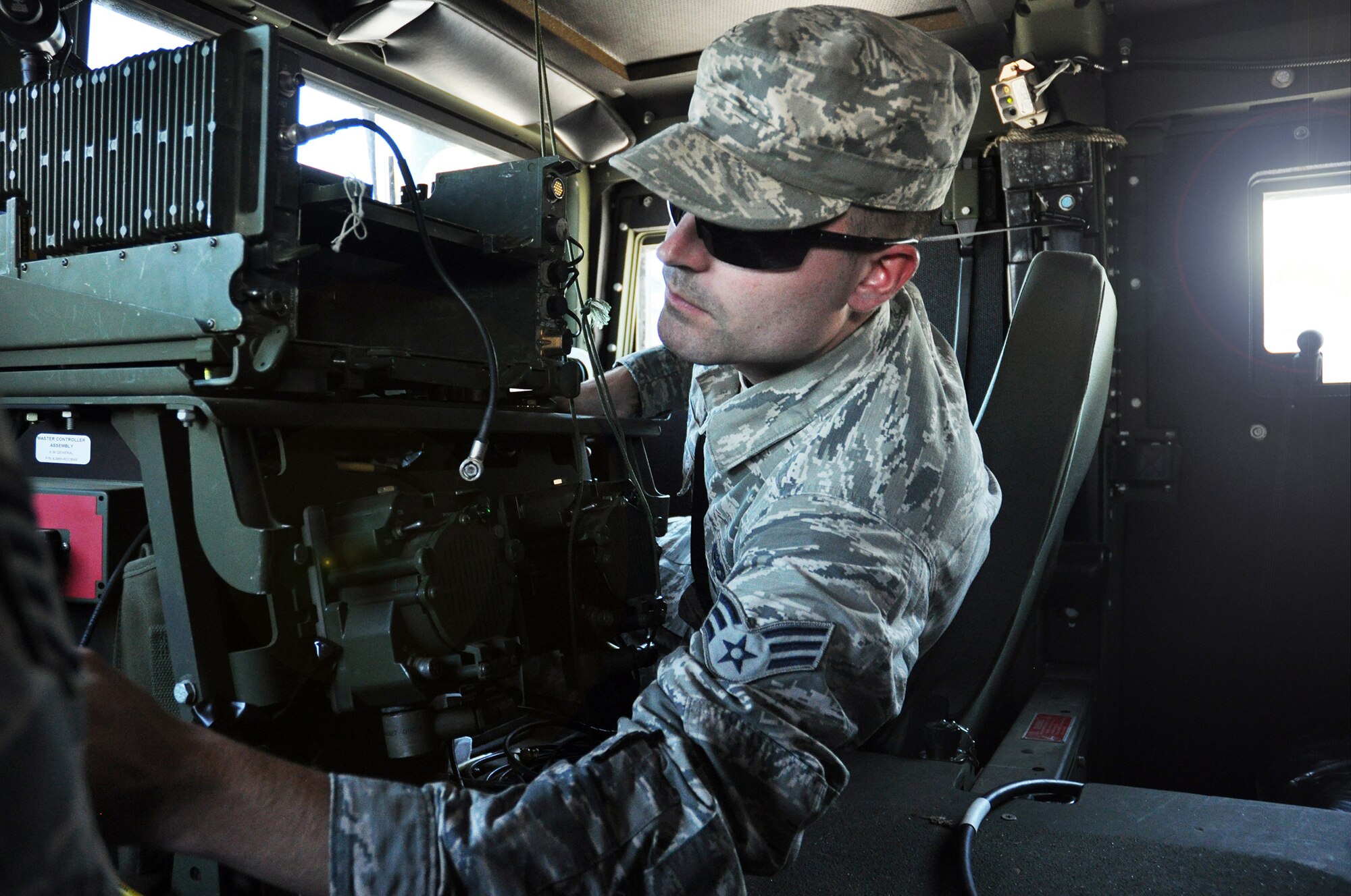 Senior Airman Christopher Hudson, 445th Civil Engineer Squadron HVAC and refrigeration Journeyman, prepares a Humvee for tactical convoy training Aug. 3, 2019.