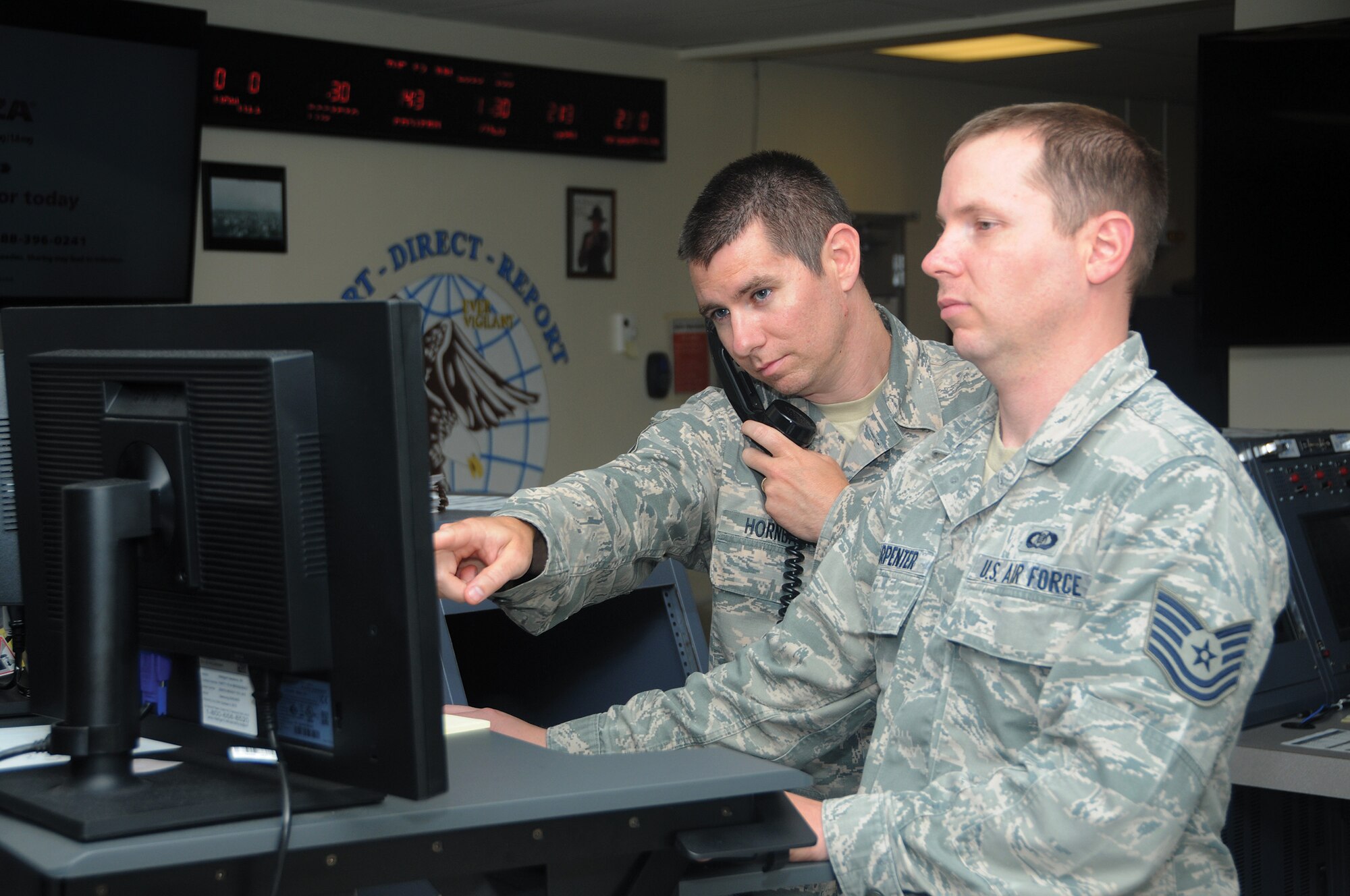 Senior Master Sgt. Darrell Hornback, 445th Command Post superintendent, conducts training with Tech. Sgt. Patrick Carpenter.