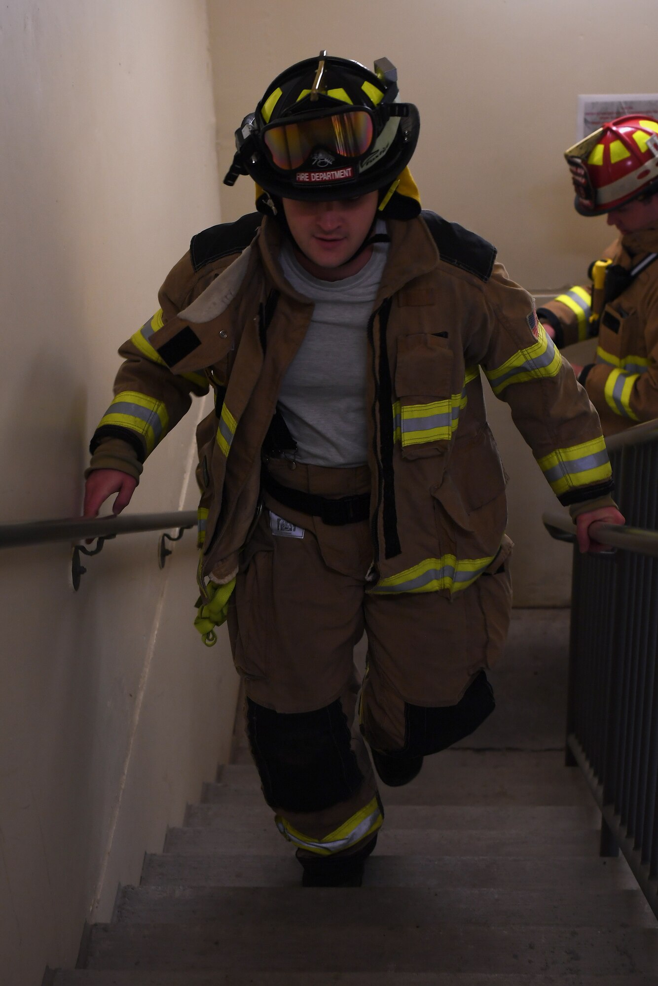 A firefighter with the 319th Civil Engineer Squadron begins his journey up the air traffic control tower during a memorial stair climb Sept. 11, 2019, on Grand Forks Air Force Base, North Dakota. The goal for all participants was to climb the tower 14 times, an equivalent of the World Trade Center’s 110 stories, to commemorate those who lost their lives in the 9/11 attacks. (U.S. Air Force photo by Senior Airman Elora J. Martinez)