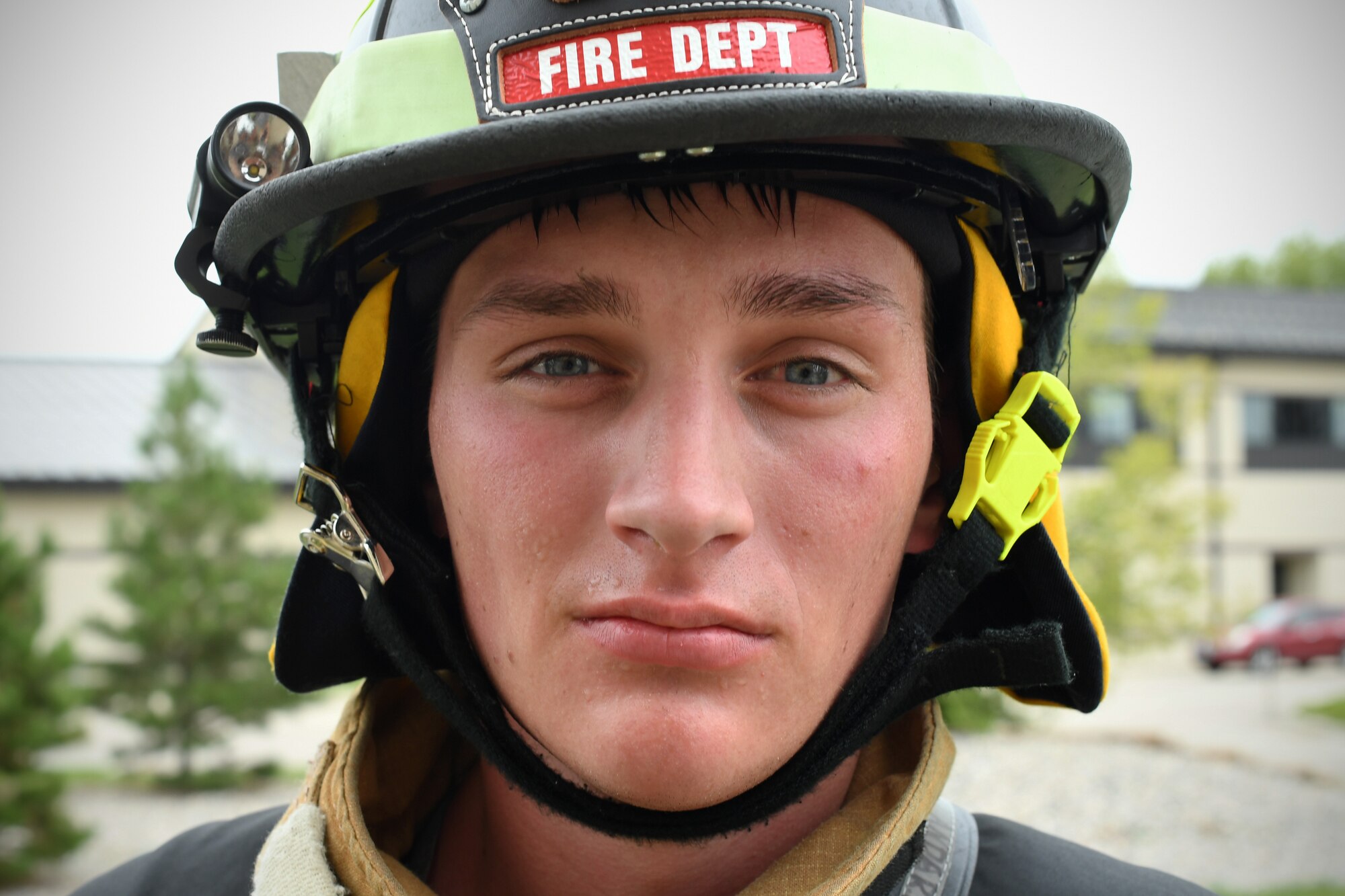 Senior Airman Jaden Anderson, lead firefighter with the 319th Civil Engineer Squadron, rests after completing a memorial stair climb Sept. 11, 2019, on Grand Forks Air Force Base, North Dakota. Anderson, along with the base fire department and other volunteer participants, completed the equivalent of the World Trade Center’s 110 stories as they climbed the base air traffic control tower 14 times. (U.S. Air Force photo by Senior Airman Elora J. Martinez)