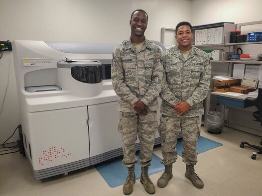Senior Airmen Jean M. Desrosiers and Angel J. Latorre, both laboratory technicians with the 514th Aerospace Medicine Squadron, 514th Air Mobility Wing at Joint Base McGuire-Dix-Lakehurst, N.J., pose for a photo September 15, 2019. Both Desrosiers and Latorre began their U.S. Air Force careers in November 2012 and have worked together since.