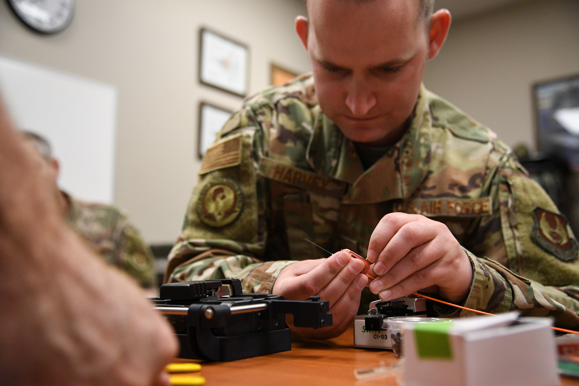 Tech. Sgt Kenan Harvey, 309th Expeditionary Depot Maintenance avionics technician, splices a fiber optic cable during a fusion splice field test at Hill Air Force Base, Utah, Sept. 10, 2019.