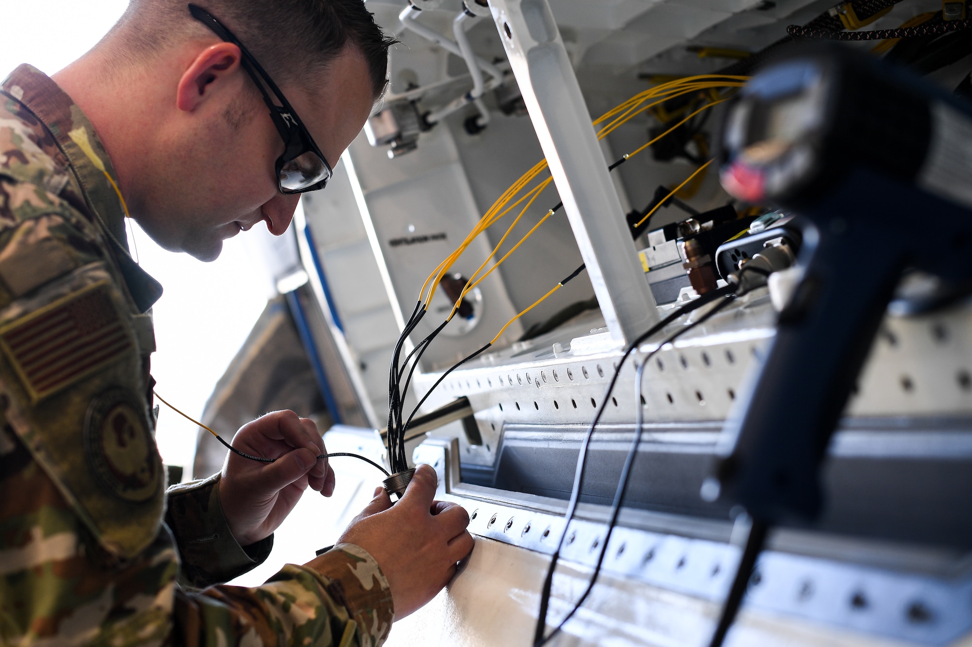 Tech. Sgt. Harvey, 309th Expeditionary Depot Maintenance avionics technician, performs a fiber optic fusion splice repair on an F-35A Lightning II at Hill Air Force Base, Utah, Sept. 12, 2019.