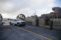 190916-N-OE749-0017 VIRGINIA BEACH, Va. (Sept. 16, 2019) U.S. Navy Aviation Boatswain’s Mate (Handling) 2nd Class Shanks Bradley, assigned to Assault Craft Unit FOUR (ACU 4) guides a vehicle from Joint Task Force Civil Support (JTF-CS) onto a landing craft air cushion as part of a joint mobile exercise. The purpose of the exercise was to increase the command’s capability to operate with the Navy to safely and efficiently deploy its vehicles and personnel during a catastrophic event. When directed, JTF-CS is ready to respond in 24 hours to provide command and control of 5,200 federal military forces located at more than 36 locations throughout the nation acting in support of civil authority response operations to save lives, prevent further injury, and provide critical support to enable community recover.  (U.S. Navy photo by Chief Mass Communication Specialist Barry Riley/RELEASED)