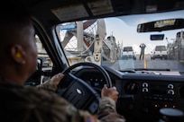U.S. Army Lt. Col. Mario Oliva, assigned to Joint Task Force Civil Support (JTF-CS) follows directions from U.S. Navy Aviation Boatswain’s Mate (Handling) 2nd Class Shanks Bradley, assigned to Assault Craft Unit FOUR (ACU 4), while loading a vehicle onto a landing craft air cushion (LCAC) during a mobile exercise. The purpose of the exercise was to increase the command’s capability to operate with the Navy to safely and efficiently deploy its vehicles and personnel during a catastrophic event. When directed, JTF-CS is ready to respond in 24 hours to provide command and control of 5,200 federal military forces located at more than 36 locations throughout the nation acting in support of civil authority response operations to save lives, prevent further injury, and provide critical support to enable community recover.  (U.S. Navy photo by Chief Mass Communication Specialist Barry Riley/RELEASED)