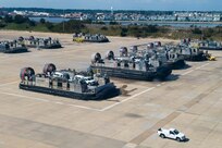 Service members from Joint Task Force Civil Support (JTF-CS) and Assault Craft Unit 4 move vehicles from Joint Expeditionary Base Little Creek-Fort Story to Fort Eustis during a mobile exercise (MOBEX) to simulate coordination and operation between the units. JTF-CS anticipates, plans, and prepares for Chemical, Biological, Radiological, and Nuclear Defense Support of Civil Authorities (CBRN-DSCA) response operations. When directed, JTF-CS deploys within 24 hours of notification to command and control DOD forces in support of civil authority response operations in order to save lives, prevent further injury, and provide temporary critical support to enable community recovery. (U.S. Navy photo by Mass Communication Specialist 2nd Class Corbin Shea/released)