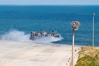 Service members from Joint Task Force Civil Support (JTF-CS) and Assault Craft Unit 4 move vehicles from Joint Expeditionary Base Little Creek-Fort Story to Fort Eustis during a mobile exercise (MOBEX) to simulate coordination and operation between the units. JTF-CS anticipates, plans, and prepares for Chemical, Biological, Radiological, and Nuclear Defense Support of Civil Authorities (CBRN-DSCA) response operations. When directed, JTF-CS deploys within 24 hours of notification to command and control DOD forces in support of civil authority response operations in order to save lives, prevent further injury, and provide temporary critical support to enable community recovery. (U.S. Navy photo by Mass Communication Specialist 2nd Class Corbin Shea/released)