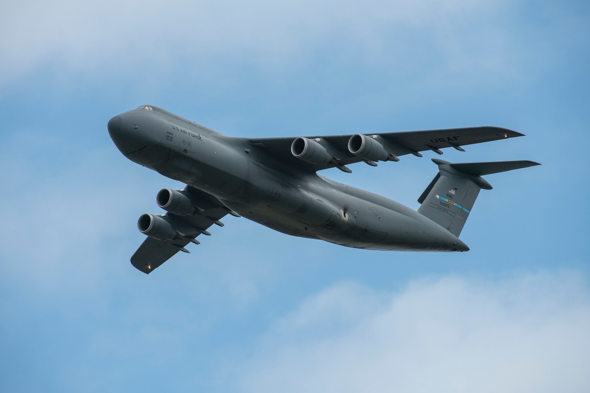 A C-5M Super Galaxy flies over the crowd  during the 2019 Thunder Over Dover Air Show, Sept. 14, 2019, at Dover Air Force Base, Del. The event featured over 20 aircraft static displays, as well as numerous aerial demonstrations. (U.S. Air Force photo by Senior Airman Christopher Quail)