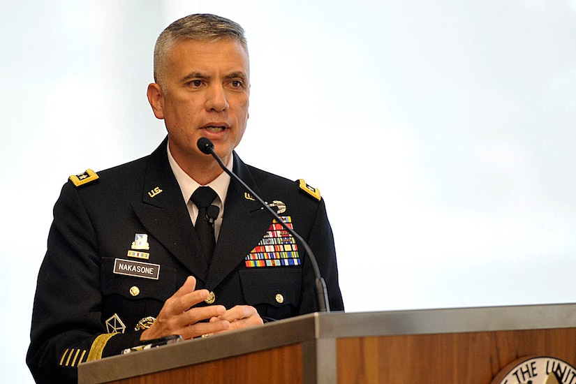 Four-star Army general speaks at lectern.