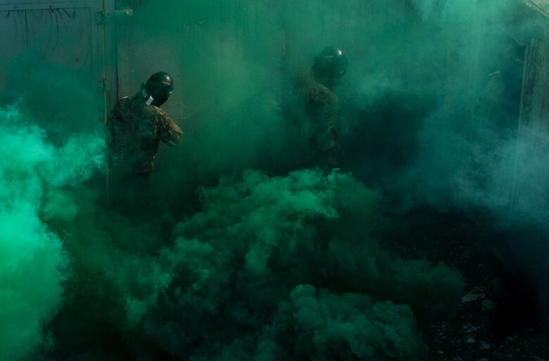 Tactical Air Control Party (TACP) Officer Phase Two (TOPT) assessment cadre follow candidates through a tactical village at Joint Base Lewis-McChord, Aug. 27, 2019. The TOPT 5-day assessment is designed primarily to create situations that allow candidates the opportunity to demonstrate their aptitude to lead in a stressful environment.