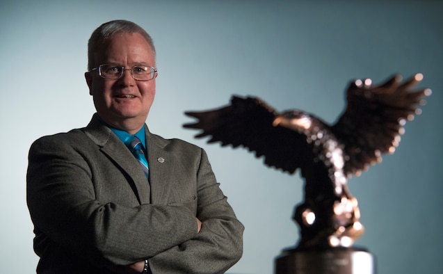 Mr. Jay Doherty, deputy of Manpower, Personnel and Services at Headquarters, Air Force Space Command, poses with his Robert E. Corsi A1 Legacy Service Award at Peterson Air Force Base, Colorado, Sept. 12, 2019. (U.S. Air Force photo by Staff Sgt. Dennis Hoffman)