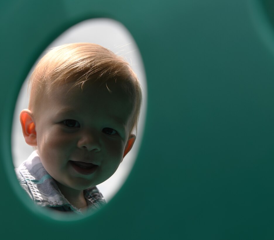 Brady Combs, the child of Staff Sgt. Jordan Combs, a 28th Bomb Wing administration executive support specialist, plays on a jungle gym at Ellsworth Air Force Base, S.D., Aug. 2, 2019. The Combs’ are currently living in on-base housing and came up with the idea to make a foster ranch where they can accommodate many more children.  (U.S. Air Force photo by Senior Airman Thomas Karol)