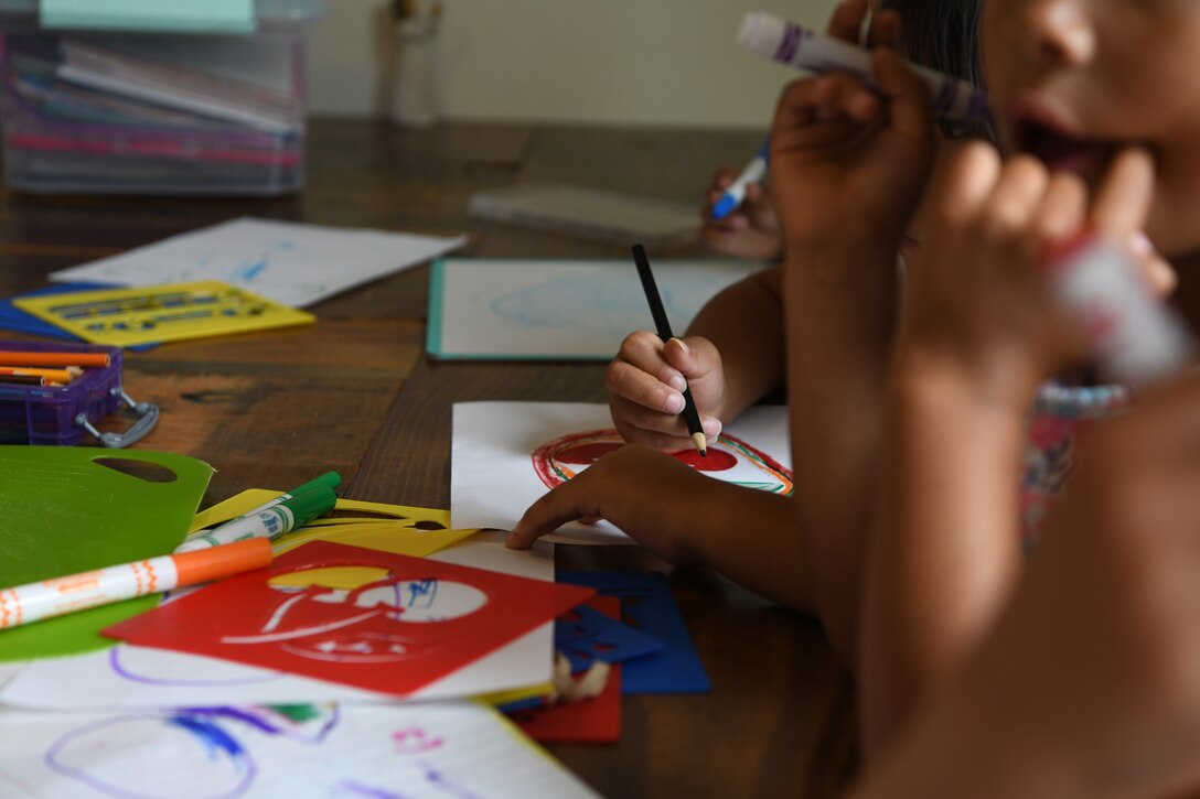 Foster children draw pictures at Ellsworth Air Force Base, S.D., Aug. 2, 2019. Staff Sgt. Jordan Combs, a 28th Bomb Wing administration executive support specialist, and his wife, Mallory, are opening up a ranch for foster children where they will have multiple activities planned to allow kids to be kids. (U.S. Air Force photo by Senior Airman Thomas Karol)