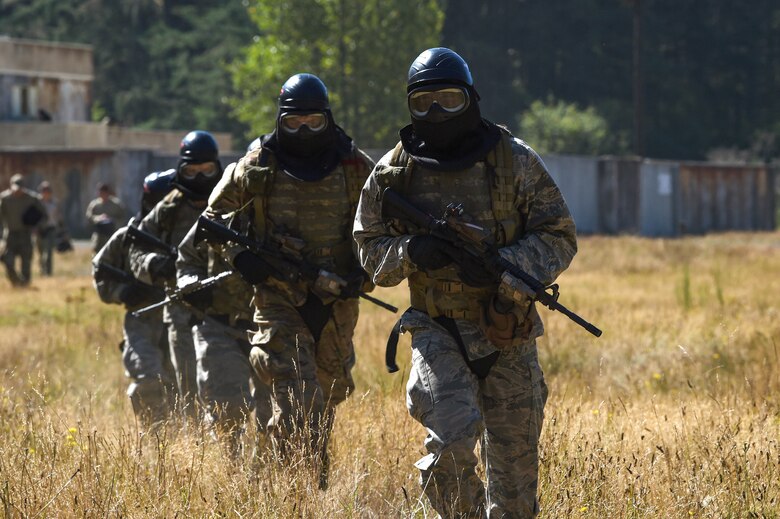 A team of tactical air control party (TACP) officer candidates run back to debrief with cadre after completing a combat leadership exercise in a tactical village on Joint Base Lewis-McChord, Wash., Aug. 27, 2019. Candidates were evaluated on their performance by experienced TACP officer and enlisted cadre throughout the week as part of the TOPT selection course phase II.