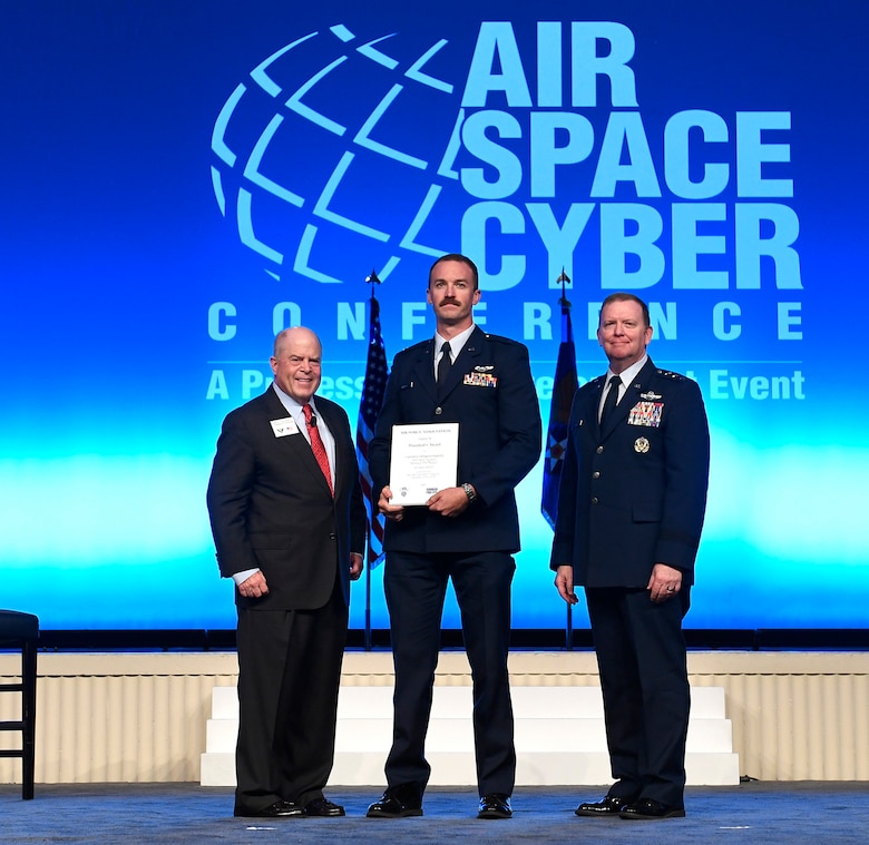 Capt. Charles Phelps receives the President’s Award during the Air Force Association Air, Space and Cyber Conference in National Harbor, Maryland, Sept. 16, 2019. The President’s Award recognizes outstanding flying achievement. (U.S. Air Force photo by Andy Morataya)