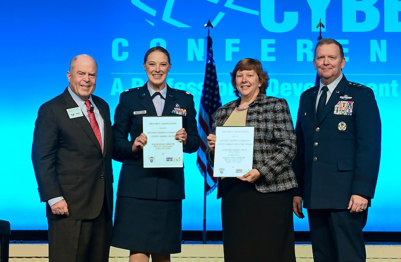 Maj. Sonja Demuth and Karen Anderson receive the Citizen Airman and Employer of the Year Award during the Air Force Association Air, Space and Cyber Conference in National Harbor, Md., Sept. 16, 2019. (U.S. Air Force photo by Andy Morataya)