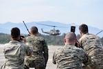 Members of a combined joint media information center team photograph a U.S. Air Force joint terminal attack controller training an Armed Forces of Bosni-Herzegovina service member in JTAC operations Sept. 11, 2019, at Tuzla International Airport, BiH during the Silver Arrow training event.