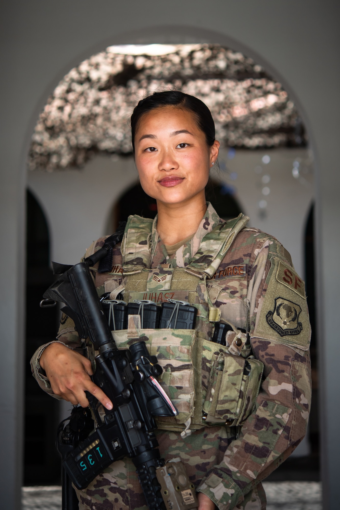 U.S. Air Force Senior Airman Chanelle Juhasz, 475th Expeditionary Air Base Squadron security forces patrolman, poses for a photo at Camp Simba, Kenya, Sep. 2, 2019. Juhasz, originally from Folsom, California, is responsible for the safety and security of all personnel and property at Camp Simba. Her hobbies include snowboarding, hiking, and hanging out with friends. (U.S. Air Force photo by Staff Sgt. Devin Boyer)