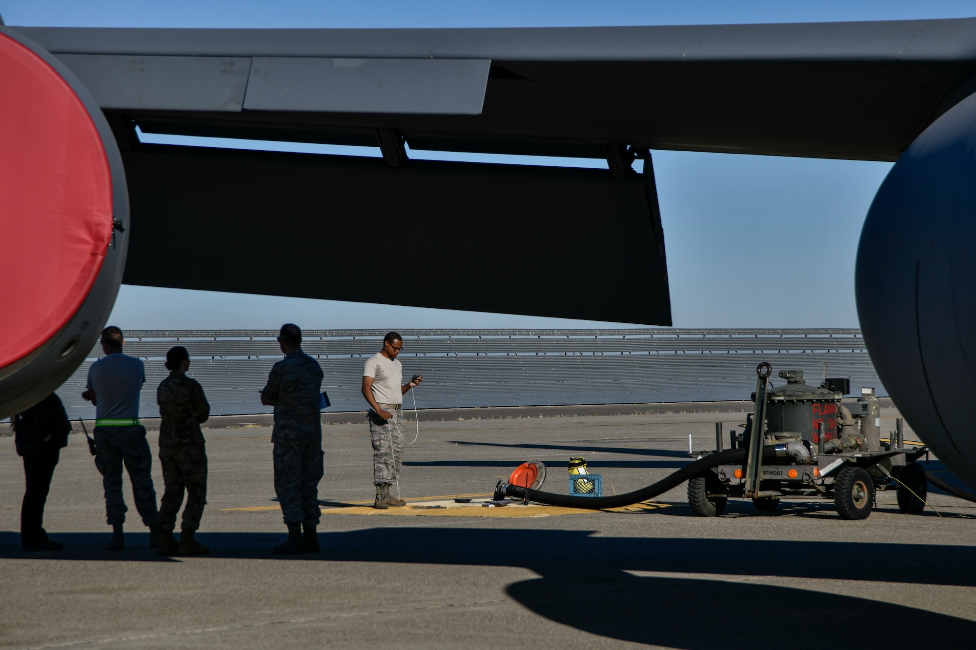 Leadership from both the 9th Logistics Readiness Squadron Petroleum, Oil and Lubricants flight and 940th Aircraft Maintenance Squadron watch as fuels distribution system operators and crew chiefs work together to refuel a KC-135 Stratotanker during a refueling exercise September 6, 2019 at Beale Air Force Base, California. (U.S. Air Force photo by Tech. Sgt. Alexandre Montes)